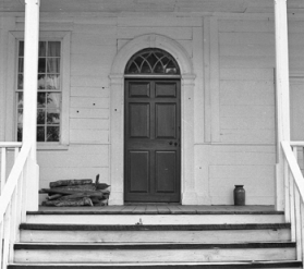 Bullet holes from the skirmish can still be seen in the house's clapboard siding.